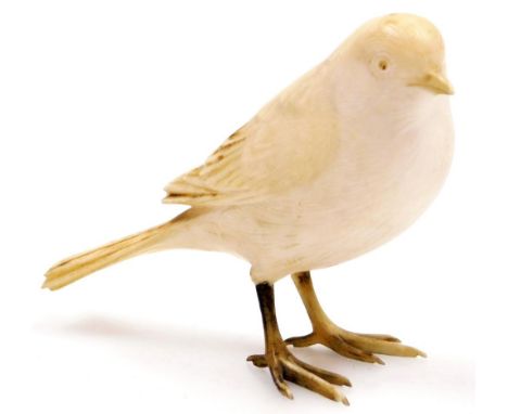 An early 20thC ivory carving of a small bird, 6cm high.