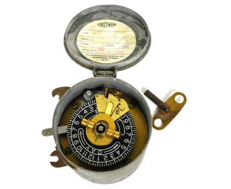 A Horstmann vintage timer switch, in a galvanized metal case, with key, 9cm diameter.