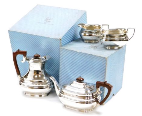 An Elizabeth II silver four piece tea set, comprising teapot, hot water jug, two handled sugar bowl and milk jug, Sheffield 1