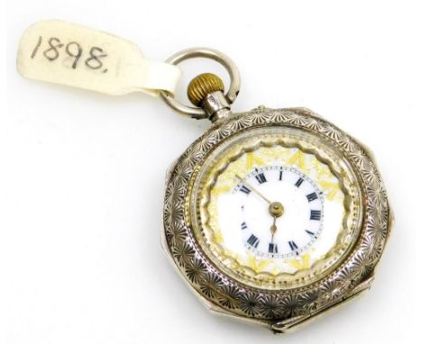 A late 19thC Swiss white metal pocket watch, of octagonal form, open faced, keyless wind, the case engraved with flowers, lea