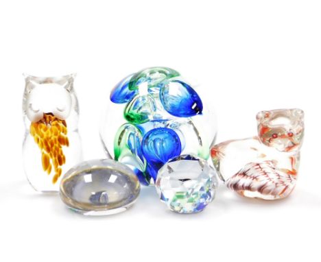 A Langham glass paperweight, in blue and green, 8cm wide, a Crystal Palace commemorative glass paperweight, 5cm wide, a facet