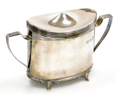 An Edwardian silver tea caddy, of oval form, with two angular handles, raised on four scroll cast feet, James Dixon, Sheffiel