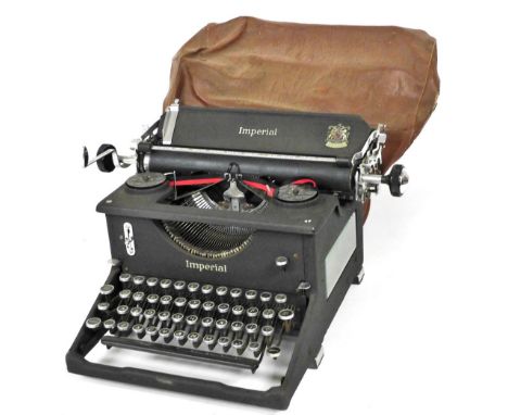 An Imperial typewriter, in black metal case, retailed by JH Todd and Sons, Lincoln. 