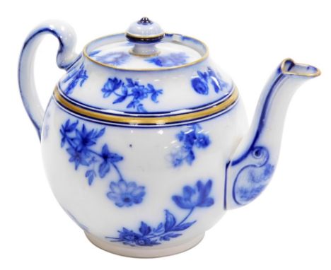 A Macintyre and Co teapot and cover, of bullet shaped form, decorated with blue transfer printed flowers against a white grou