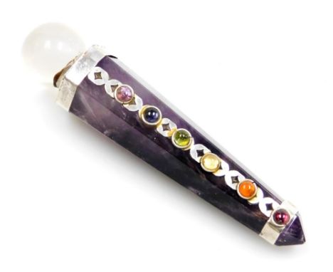 An amethyst stone chakra stick, or healing wand, with white metal applied caps and semi precious stone band, with clear cryst