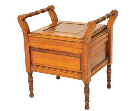 An Edwardian satin walnut commode, with shaped handles, fitted interior and turned legs, 58cm high, 58cm wide, 44cm deep. 