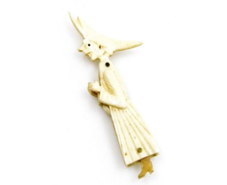 A 19thC novelty articulated bone figural carving of a French nun, possibly prisoner-of-war work, with miniature spoon and too