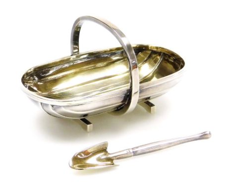 An Elizabeth II silver miniature garden trug and trowel, London 1988, the trug 9.5cm wide, 2¾oz. 