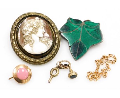 A group of costume jewellery, comprising a white metal and malachite leaf brooch, a cameo set in gilt metal mount, a yellow m