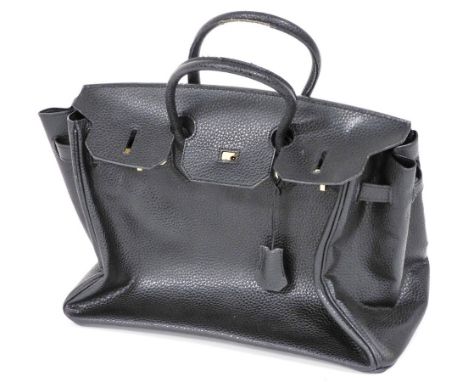 A black leather handbag, with gold coloured hardwear and turn lock closure, 37cm wide.