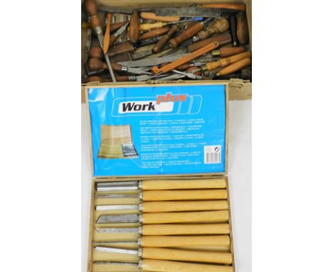 A Workplus wood lathe tool set, boxed, comprising three gouges, semi-circular cutter, grooving cutter, groove cutter and two 
