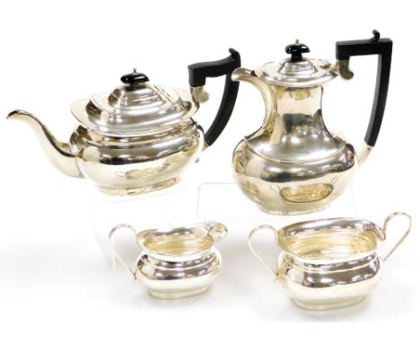 A George V silver four piece tea set, in the Georgian style, comprising teapot, hot water jug, cream jug and sugar bowl, Shef