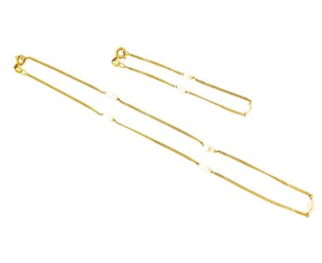 A fresh water pearl necklace and matching bracelet, each set in 9ct gold.