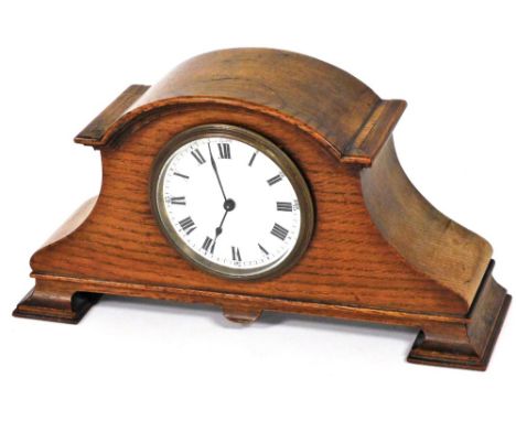An Edwardian oak mantel clock, circular enamel dial bearing Roman numerals, Arabic numerals at quarters, Buren clockwork move