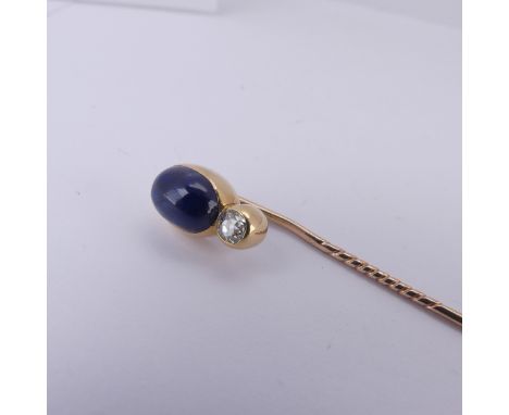 An early 20thC Russian sapphire and diamond Stick Pin,&nbsp;the oval cabochon sapphire approx. 10.5mm long with an old cut di