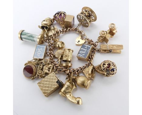 A 9ct rose gold curb link Bracelet, with 9ct gold padlock clasp, suspended with 22 various 9ct gold charms, all marked includ
