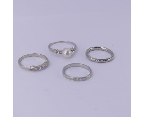 Four 18ct white gold Rings; one set single cultured pearl with diamond points, Size M, one with five small diamonds, Size M, 