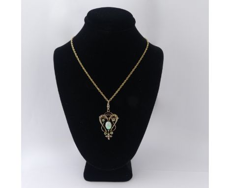 An Art Nouveau opal Pendant, the central oval opal in scrolling open surround set demantoid garnets and seed pearls, with see