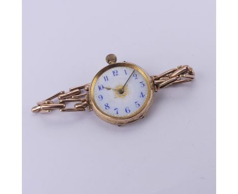 A Continental 14k gold lady's Fob Watch, the pretty enamel dial with blue Arabic numerals, manual crown wind movement, runnin