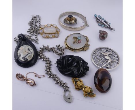 A 19thC banded agate mourning Pendant / Brooch, of target form, the central stone with enamelled black Greek Key border, box 