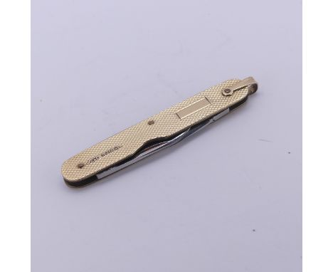 A 9ct yellow gold Penknife, with engine turned decoration and two folding steel blades, vacant cartouche, 6cm long, gross tot