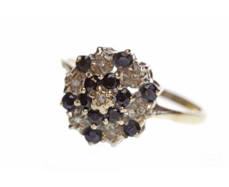 NINE CARAT GOLD GEM AND DIAMOND CLUSTER RING
the round bezel set with round black stones interspaced by round diamonds, size 