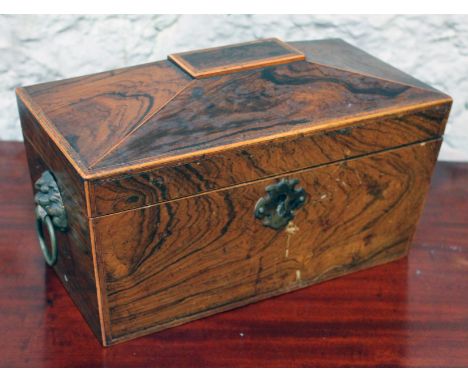 A 19th Century rosewood tea caddy with fitted interior.