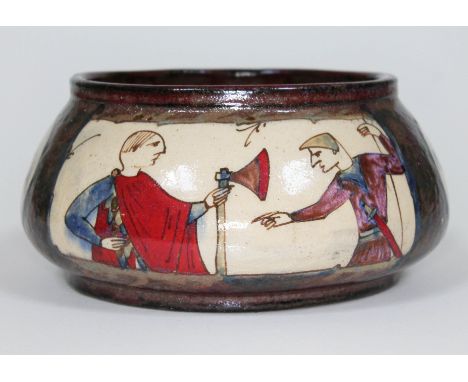 A French earthenware bowl by Louis Ettiene Desmant panelled decoration depicting scenes from the Bayeux tapestry, inscribed t