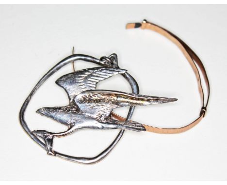A Scottish hallmarked silver pendant formed as a bird of prey catching a fish, length 4.5cm, together with a yellow metal ban
