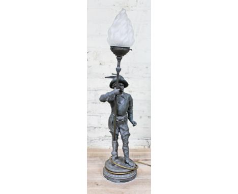A spelter lamp with glass shade, length 80cm.Condition:  cracks to both ankles, missing cane/spear? cracks and repair to shad