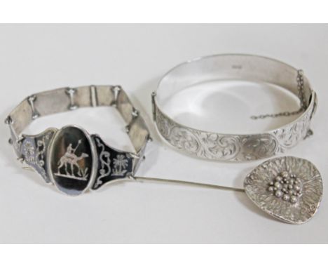 A mixed lot comprising contemporary Arts & Crafts hallmarked silver hat pin, a hallmarked silver bangle and an Eastern white 