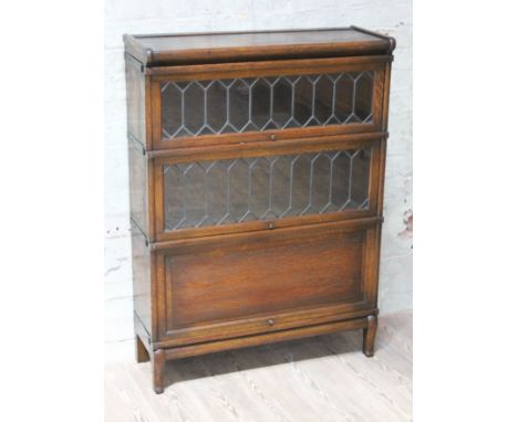 A Globe-Wernicke oak and leaded glass three part sectional bookcase, width 87cm, depth 31cm & height 120cm.