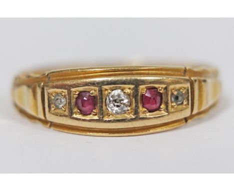 An Edwardian hallmarked 18ct gold diamond and ruby ring, gross wt. 2.9g, size R.