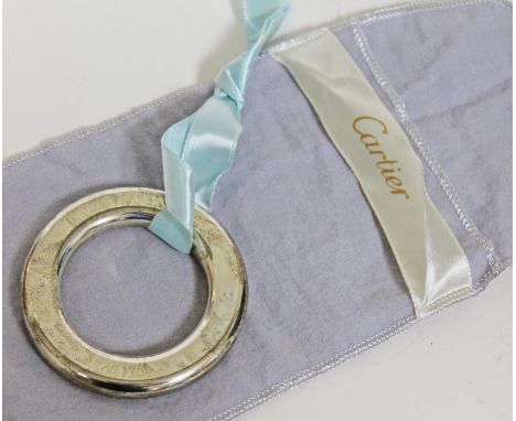 A Cartier Sterling silver rattle, diam. 7.6cm, with cloth case.Condition: no damage, minor wear, tarnishing, no dents.