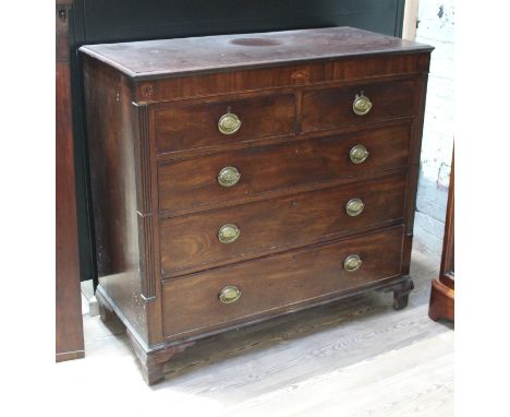 A Georgian mahogany chest of drawers with quarter columns, inlaid, gilt brass handles and ogee bracket feet, width 120cm, dep