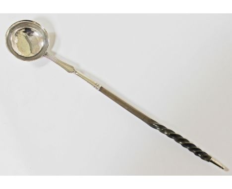 A Georgian 18th Century silver punch ladle with twist handle, hallmarks indistinct, length 37cm.