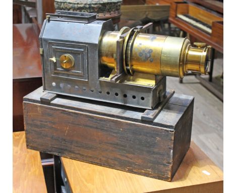 A late 19th Century Magic Lantern, the 'Praestantia' by Riley Bros, Bradford, together with a box of slides including a movin