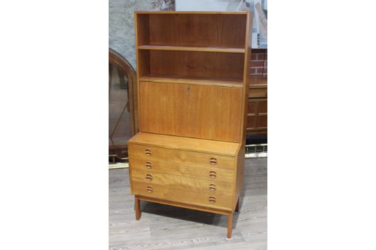 A Danish Style Teak Chest Of Drawers With Buearu Bookcase Top