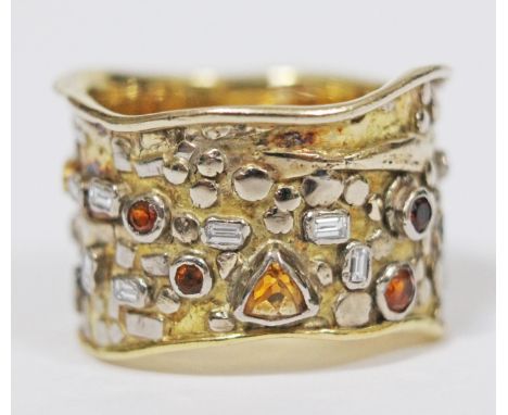 A contemporary Arts & Crafts style wedding ring set with diamonds and citrines, crafted in 18ct yellow and white gold, unmark