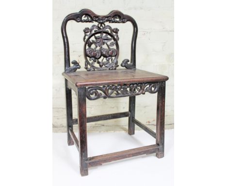 A Chinese hardwood chair, 19th Century, having carved and pierced back and frieze depicting fruits, square section leg with s