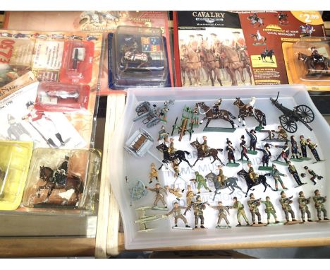 Approximately seventy cast metal and resin military figures and guns. Includes magazine issue types, mostly in good condition