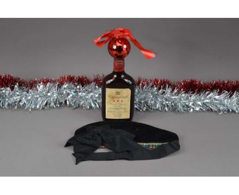 A bottle of first half 20th century Crawfords Special Reserve Blended Old Scotch Whisky, together with a Scottish hat, possib