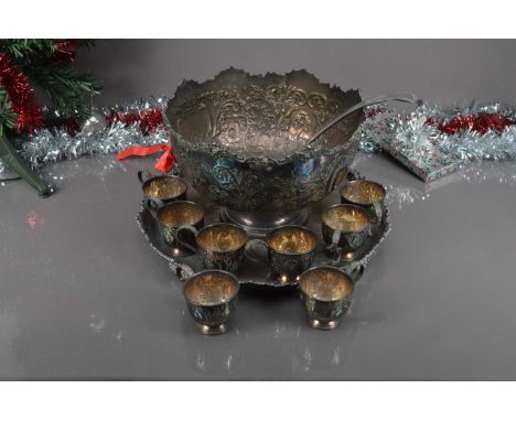 A mid 20th century silver plated punch bowl and stand by Pepper & Hope, with eight matching cups and a ladle, bowl 42 cm diam