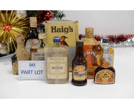 A small collection of alchohol and spririts, including a boxed Haig's Dimple blended Scotch whisky, appears unopened, along w