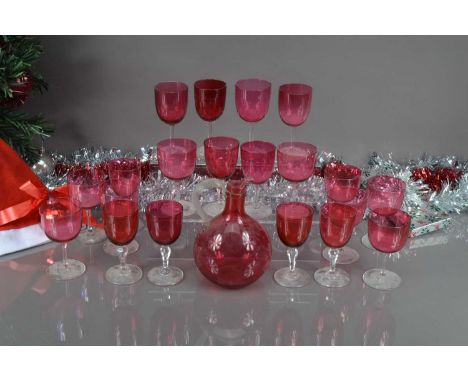 Twenty vintage red liquor glasses and a decanter