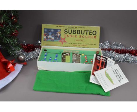 A 1960s Subbuteo Table Soccer Super Set, overall in fair ot good condition, lacks one ball, one blue player headless, with 19