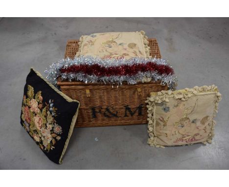A large early 21st century wicker hamper from Fortnum & Mason and three cushions