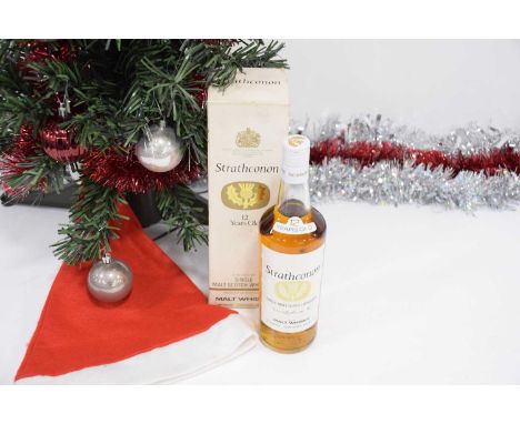 A bottle of Strathconon Single Malt Scotch Whisky, unopened and level may be a little low, possibly numbered 74/637, 26 2/3 f