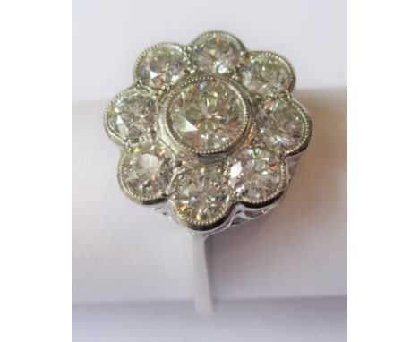 Platinum diamond flowerhead cluster ring, the nine diamonds approximately 1.50ct totalThis is a modern ring in excellent cond