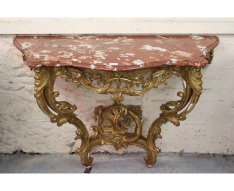 19th Century French giltwood console table, the variegated rouge marble top above a pierced floral frieze, pierced floral dec